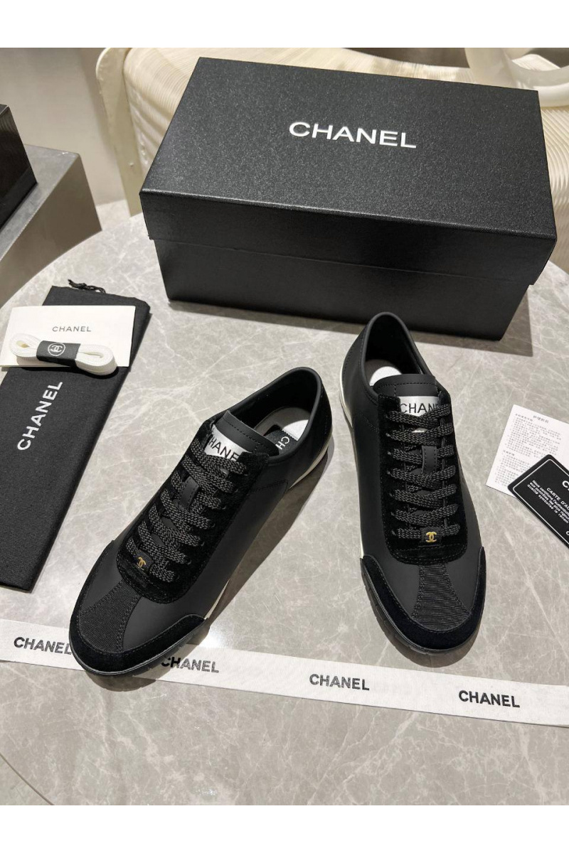 Chаnеl Женские кожаные кроссовки чёрного цвета