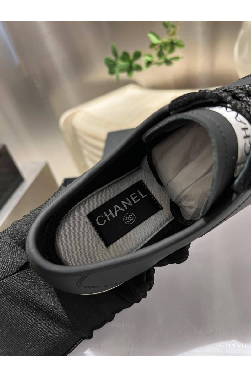 Chаnеl Женские кожаные кроссовки чёрного цвета