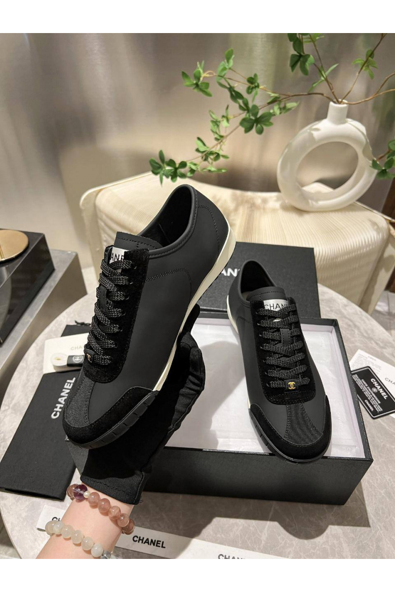 Chаnеl Женские кожаные кроссовки чёрного цвета