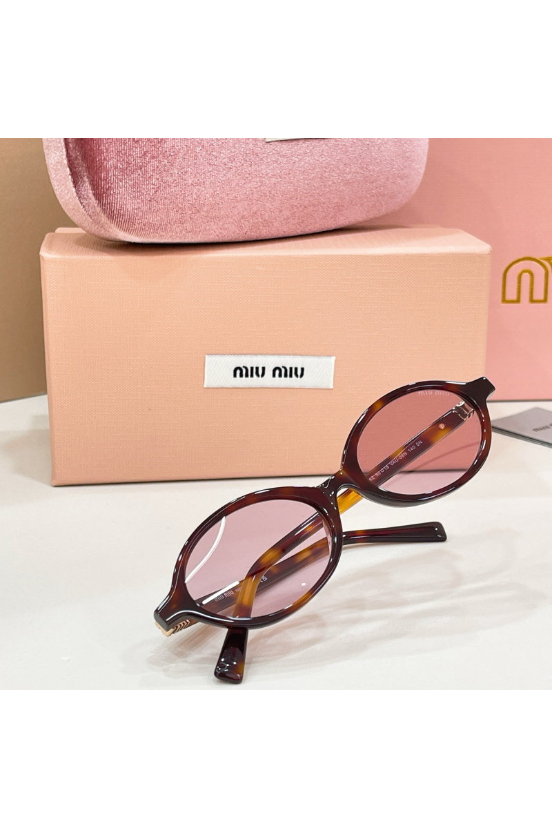 MIU MIU Солнцезащитные очки с леопардовой оправой